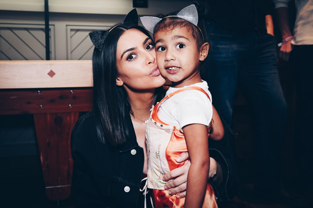 Kim Kardashian and North West attend Ariana Grande concert