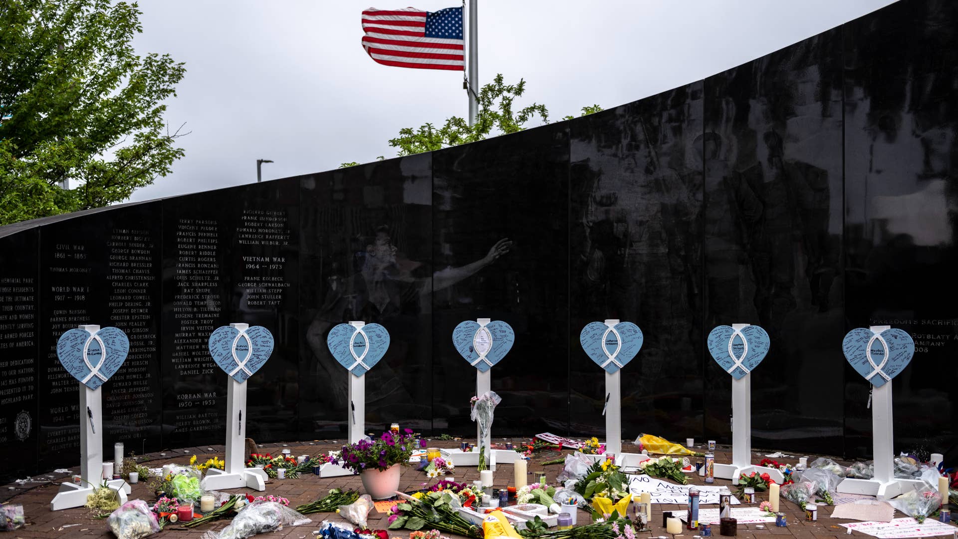 A memorial for Illinois mass shooting victims is pictured