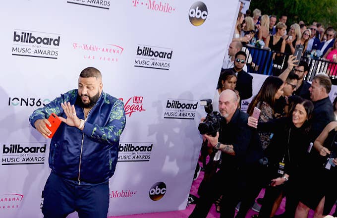 DJ Khaled (L) arrives at the Billboard Music Awards