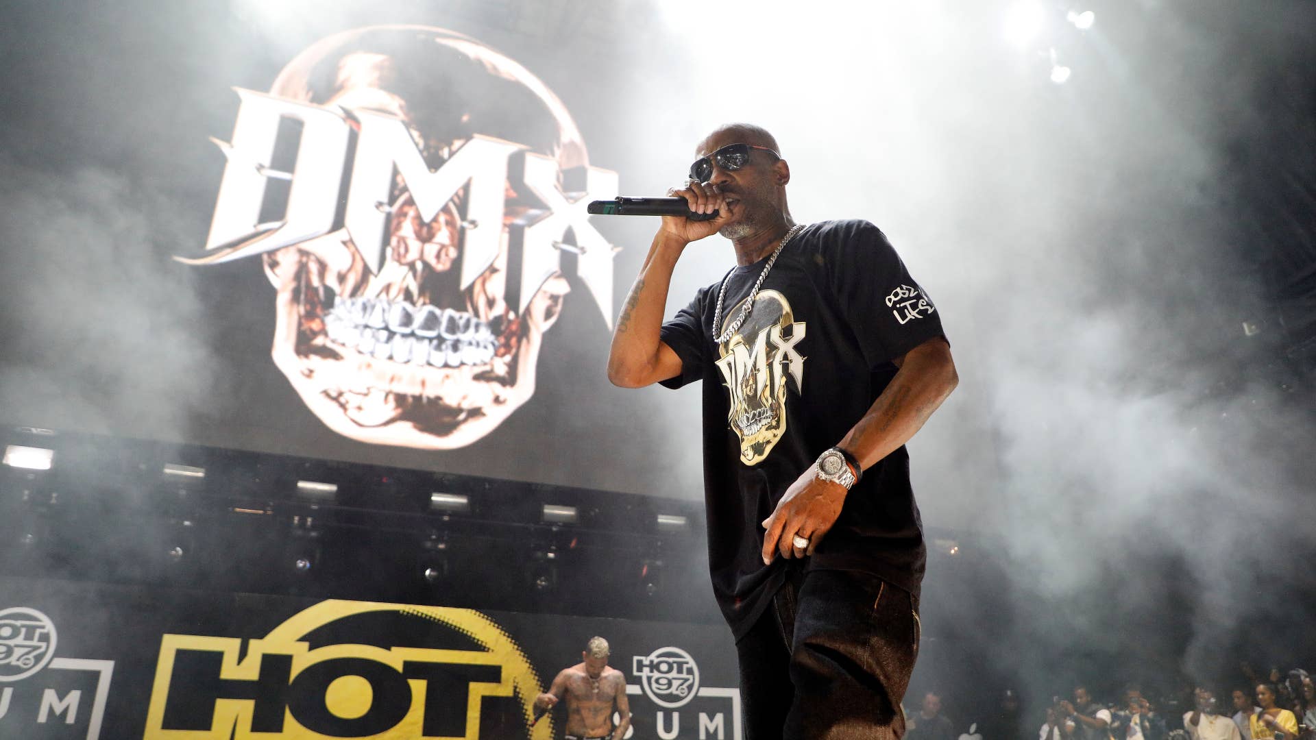 DMX is seen holding the mic while performing