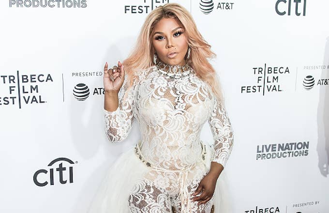 Rapper Lil' Kim attends the 'Can't Stop, Won't Stop: The Bad Boy Story' Premiere