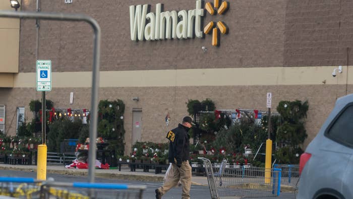 An FBI agent is seen outside a Walmart store