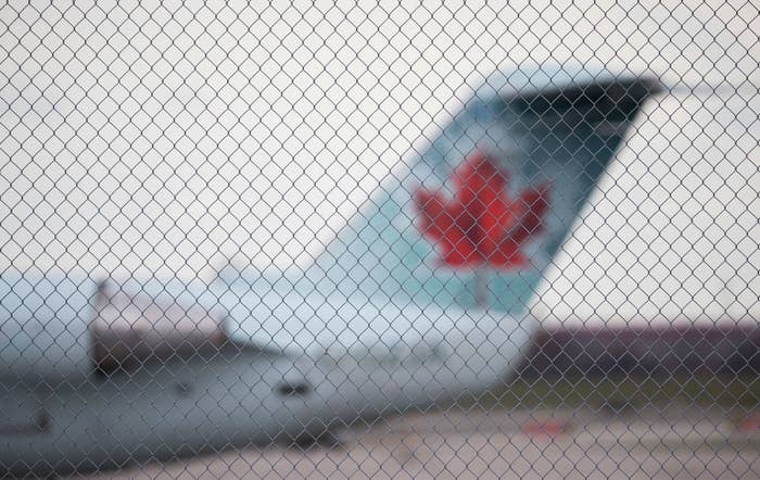 Air Canada aircraft parked on the apron at airport. Aircraft at Pearson International Airport