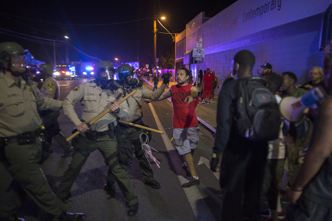 Police and protestor clash.