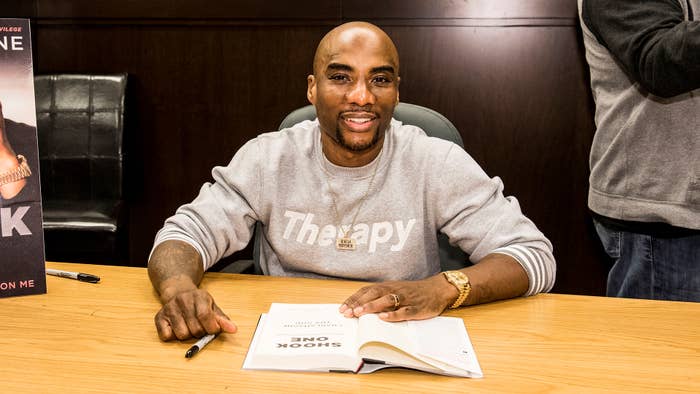 Charlamagne of &#x27;The Breakfast Club&#x27; fame signing a book.