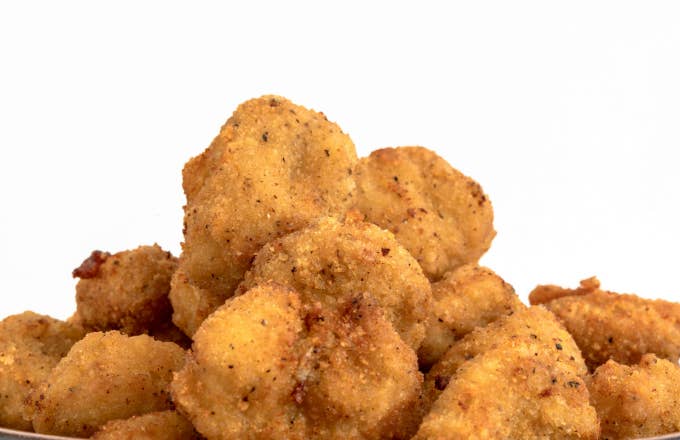 Close up of Chicken Nuggets over a white background