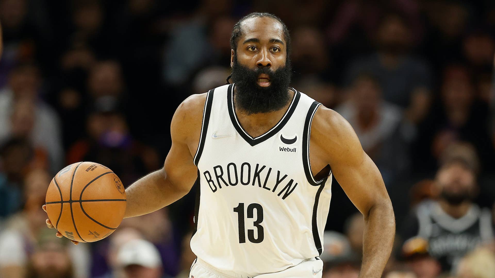James Harden #13 of the Brooklyn Nets handles the ball.