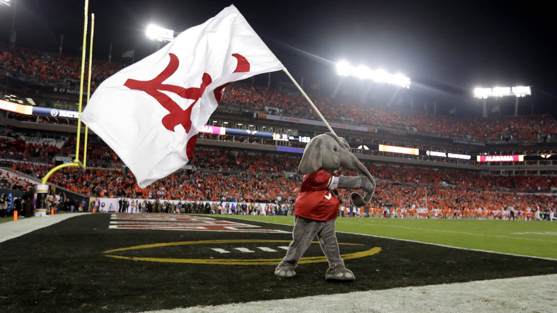 Alabama mascot Big Al waving Alabama flag at National Championship