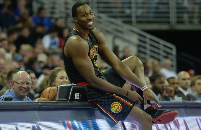 Dwight Howard prepares to check in to a game for the Hawks.
