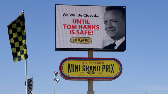 A digital billboard displays a humorous message about actor Tom Hanks