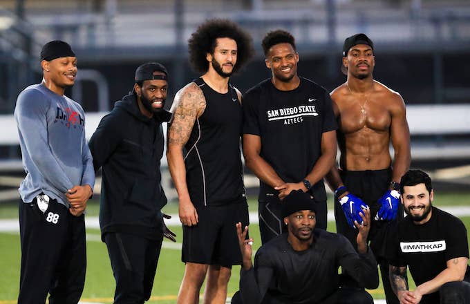 Colin Kaepernick stands with Jordan Veasy, among others. during NFL workout
