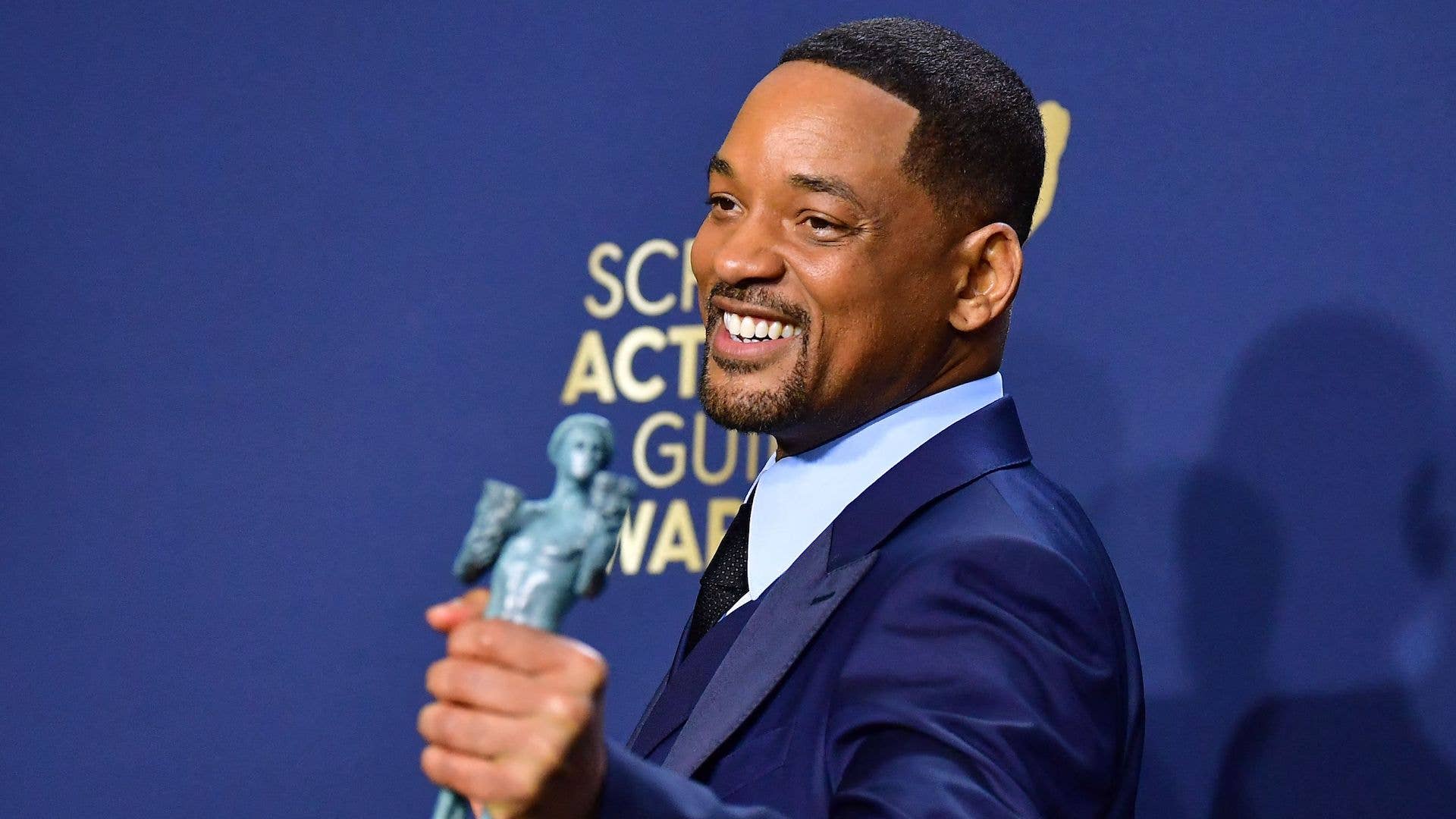 US actor Will Smith poses in the press room with his award for Outstanding Performance by a Male Actor.
