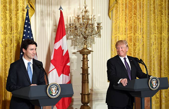 Donald Trump (R) attends a joint press conference with Justin Trudeau