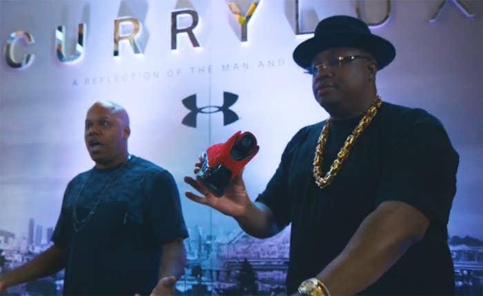 E 40 holding Steph Curry&#x27;s Under Armour Shoes