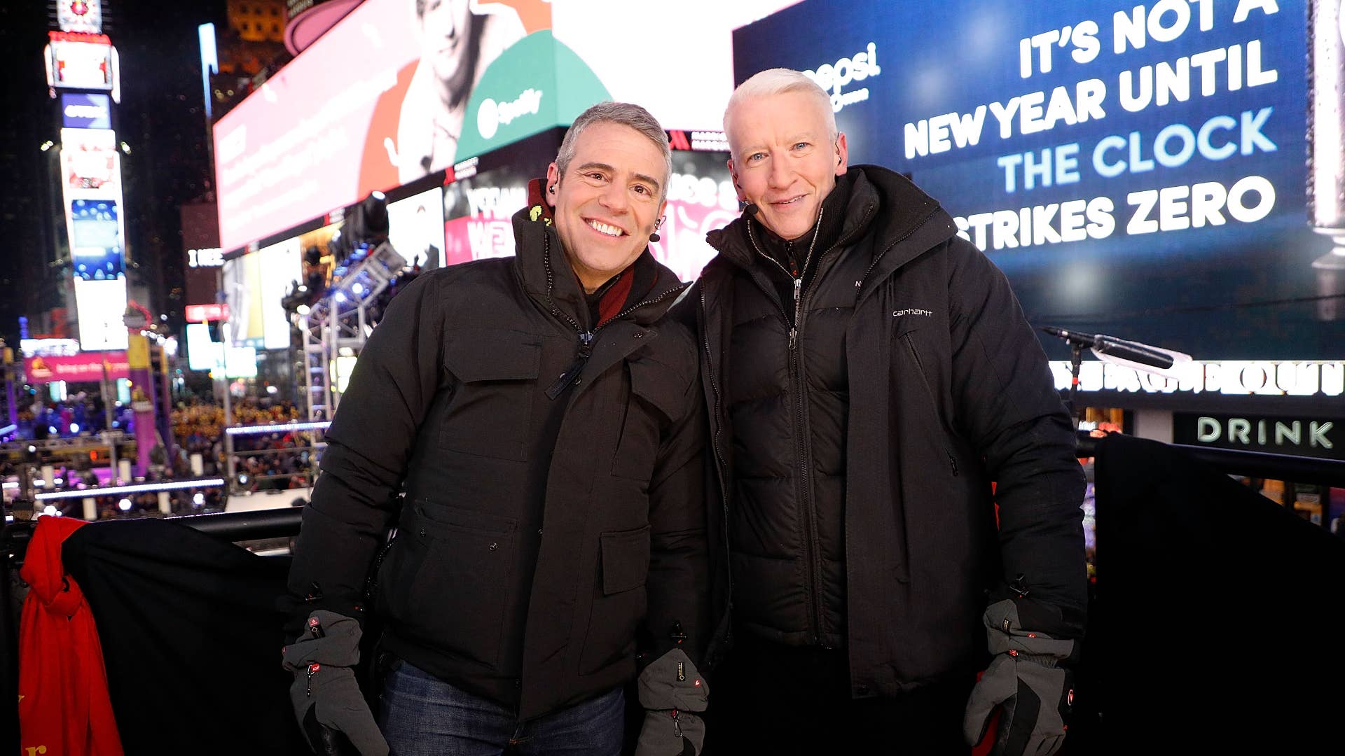 Andy Cohen and Anderson Cooper host CNN's New Year's Eve coverage at Times Square.