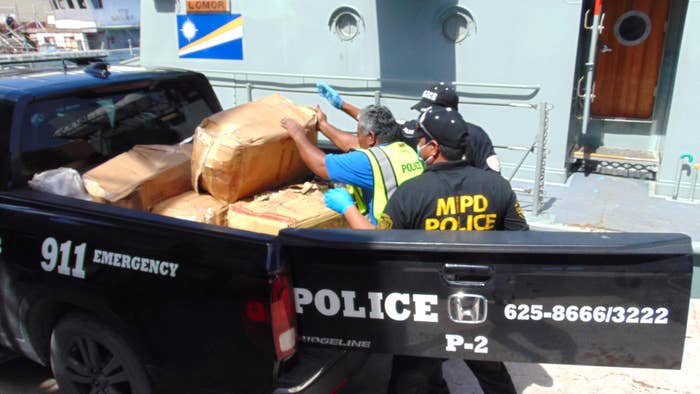 Police loading cocaine into truck