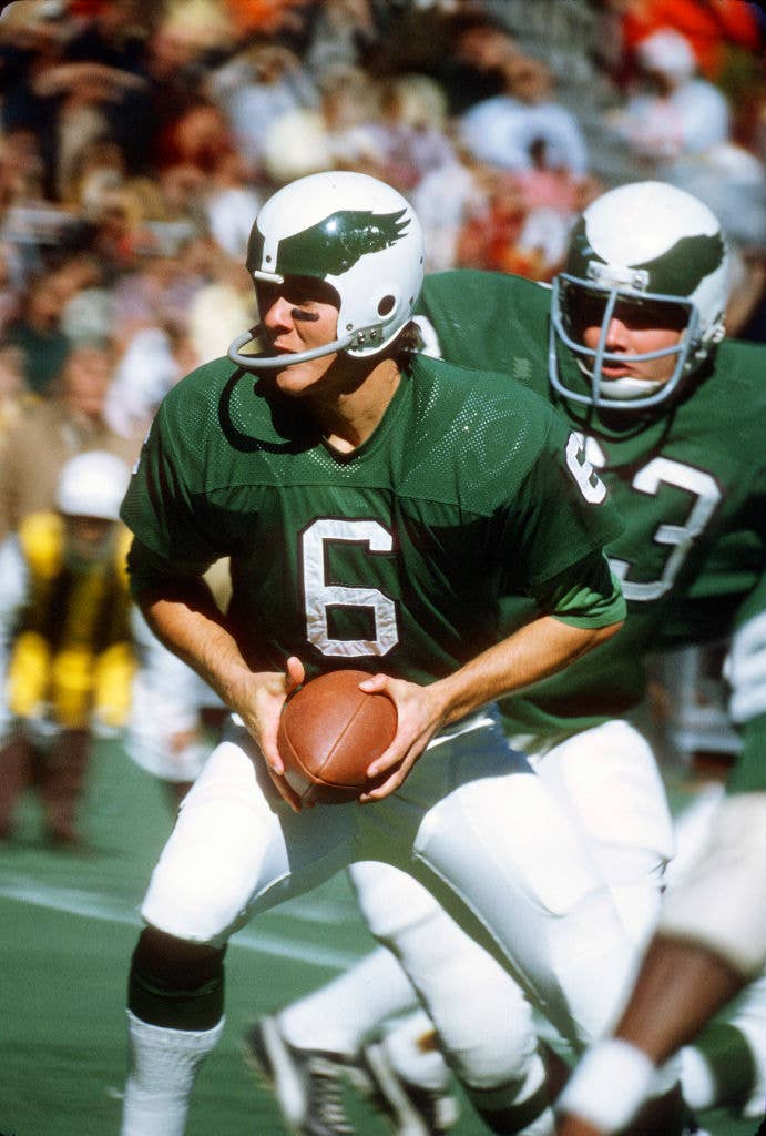 Quarterback John Reaves of the Philadelphia Eagles drops back to