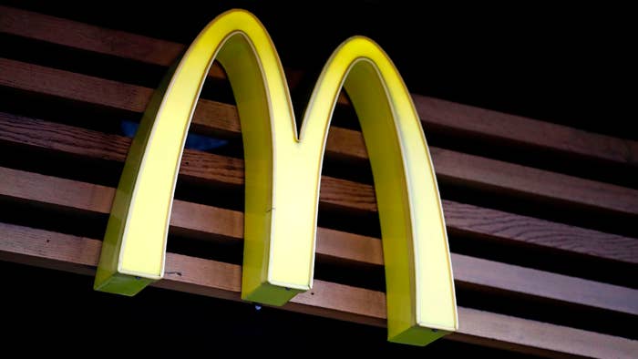 A logo of McDonalds is pictured above a branch of the fast food restaurant in central London.