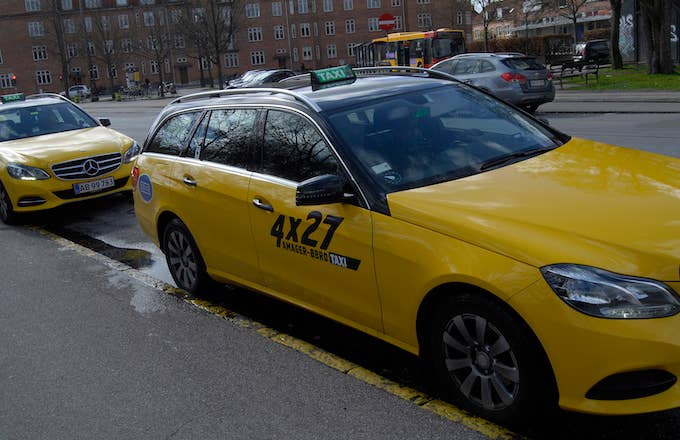 A yellow and black danish taxi