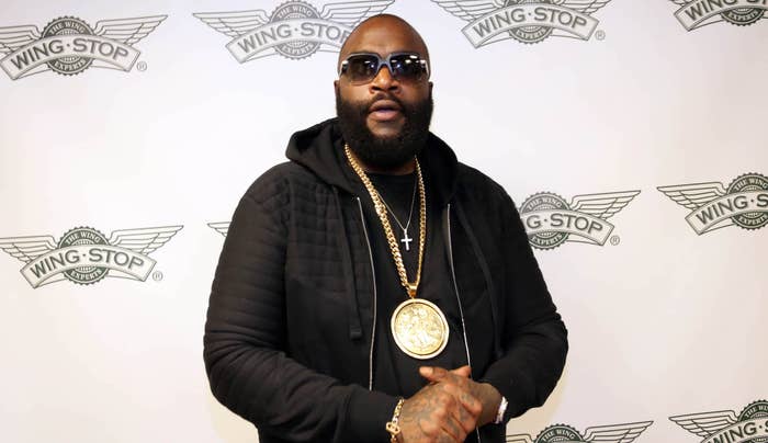 Rick Ross on red carpet at Wingstop event