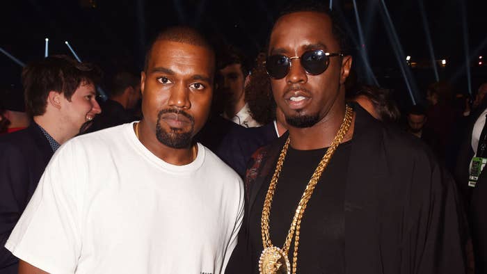 Kanye West and Sean Diddy Combs pose backstage