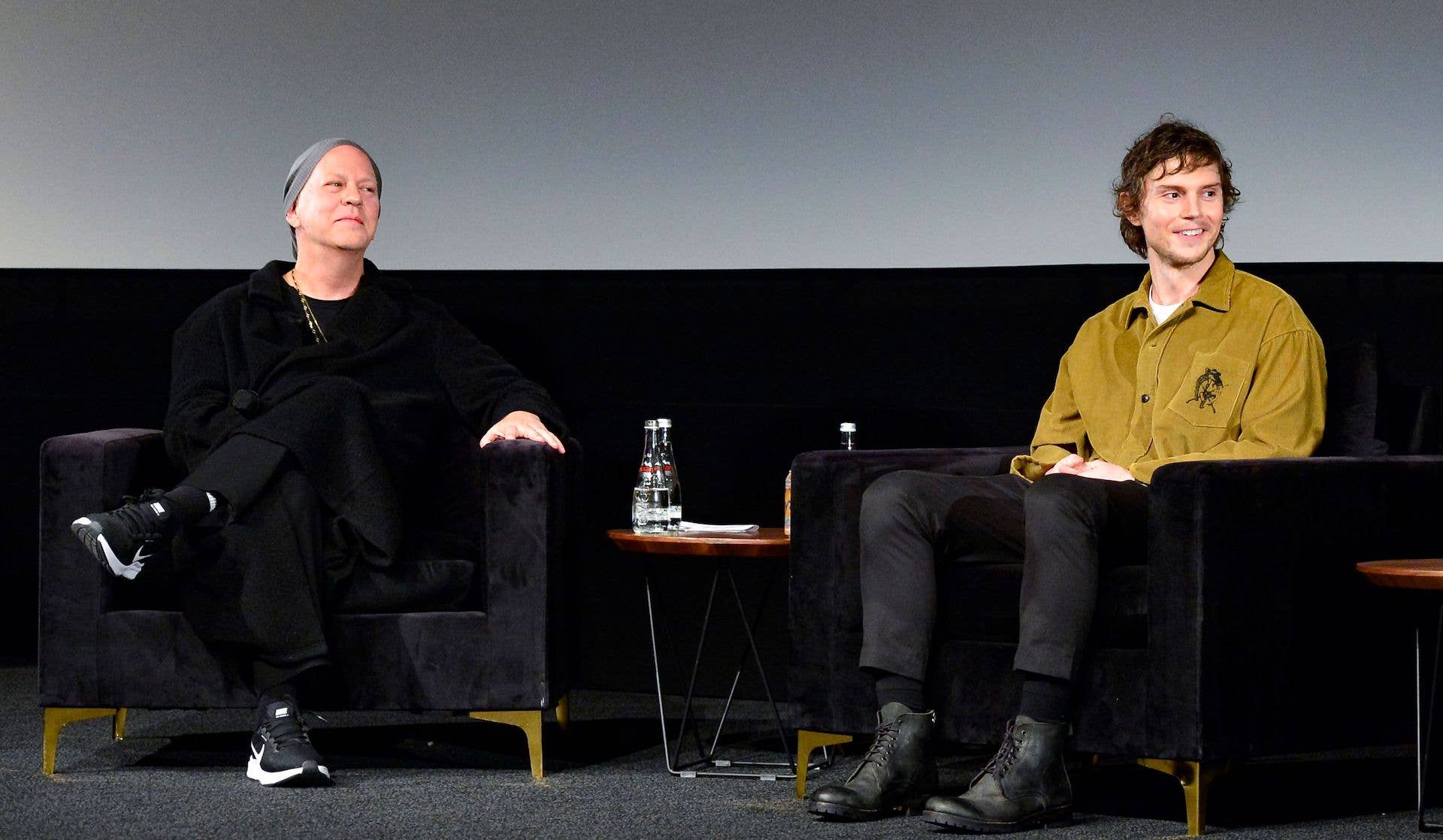 Ryan Murphy and Evan Peters speak onstage during Netflix's 'Dahmer - Monster: The Jeffrey Dahmer Story' Guild Event