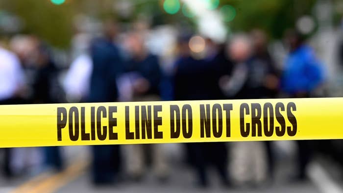 Police tape secures a crime scene