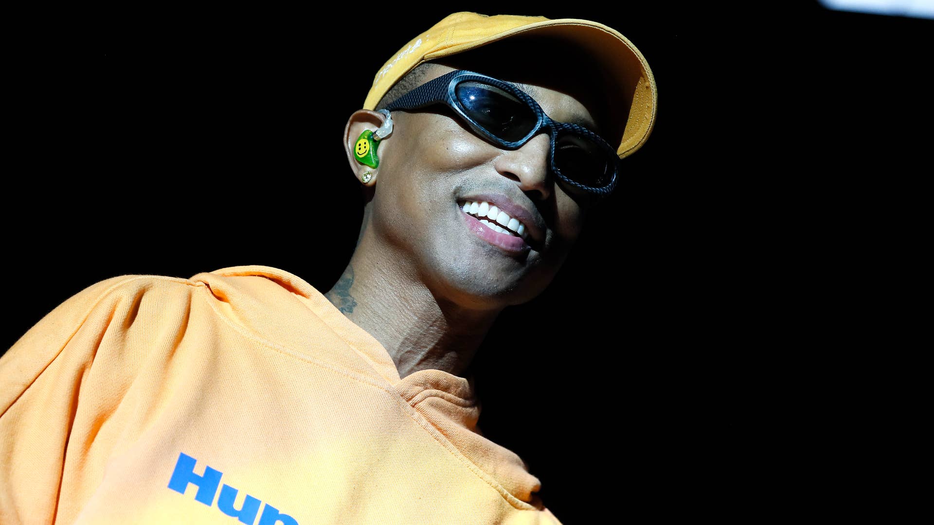 Pharrell is pictured performing for fans