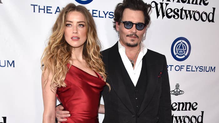Amber Heard and Johnny Depp are pictured walking the red carpet