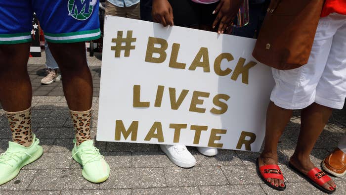Supporters of Casey Goodson Jr. hold a # Black Lives Matter sign