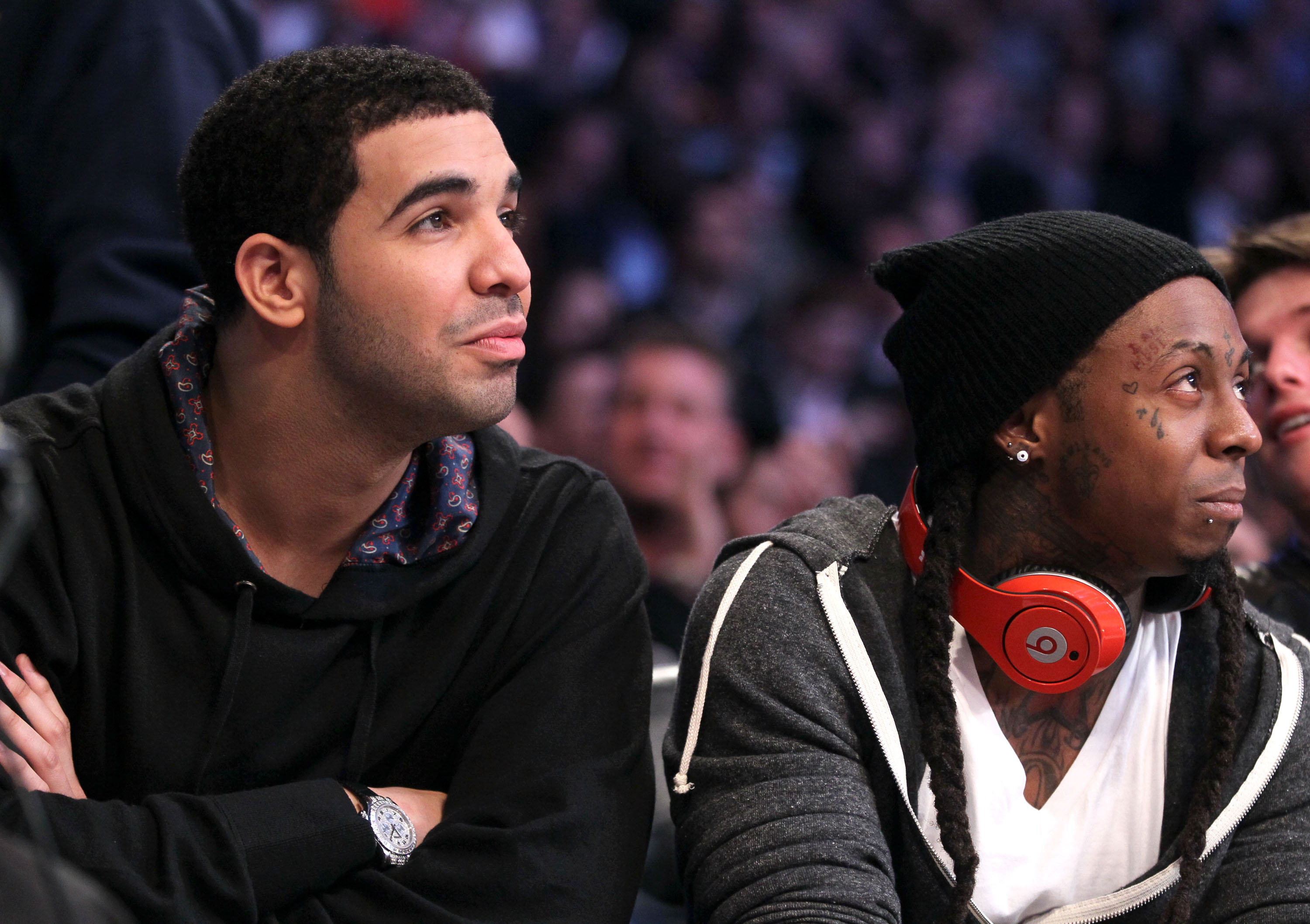 Drake and Lil Wayne at a basketball game