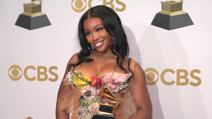 SZA holds her Grammy award for  Best Pop Duo Group Performance Award