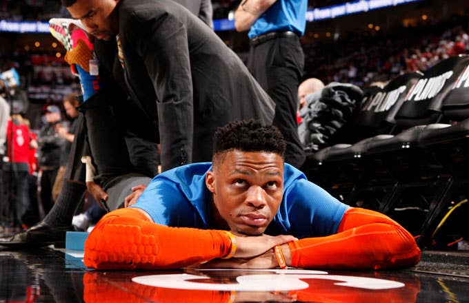 Russell Westbrook stretches before a 2019 playoff game.