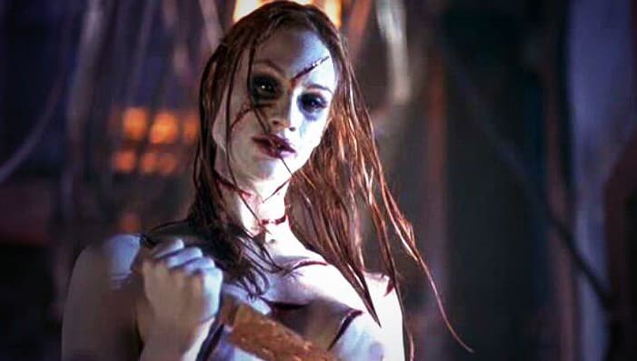 woman holds knife in thirteen ghosts