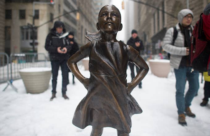 The Fearless Girl statue stands in the snow