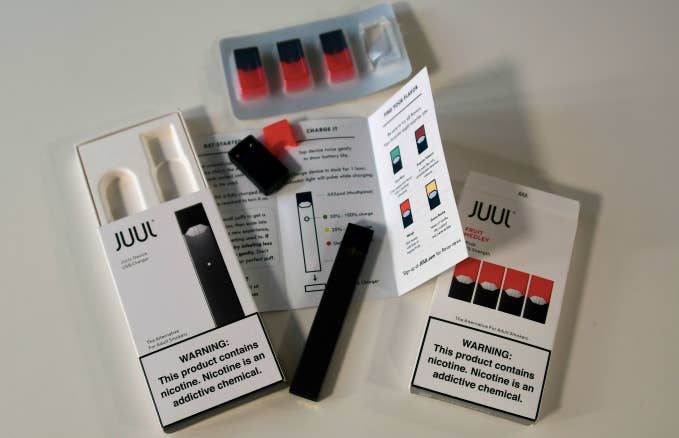 An illustration shows the contents of an electronic Juul cigarette box