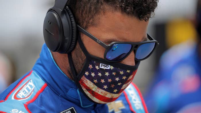 Bubba Wallace stands on the grid prior to the NASCAR Cup Series GEICO 500.