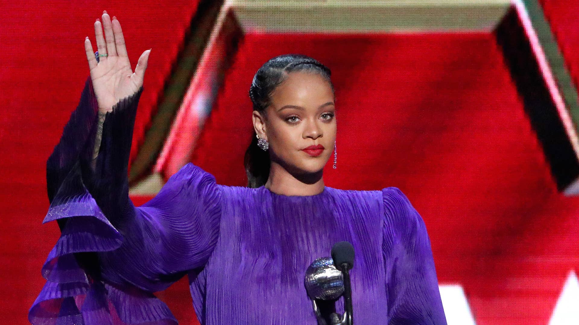 Rihanna accepts the President's Award onstage during the 51st NAACP Image Awards