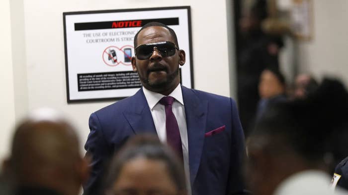 Singer R. Kelly walks into court at the Daley Center for a hearing on his child support case