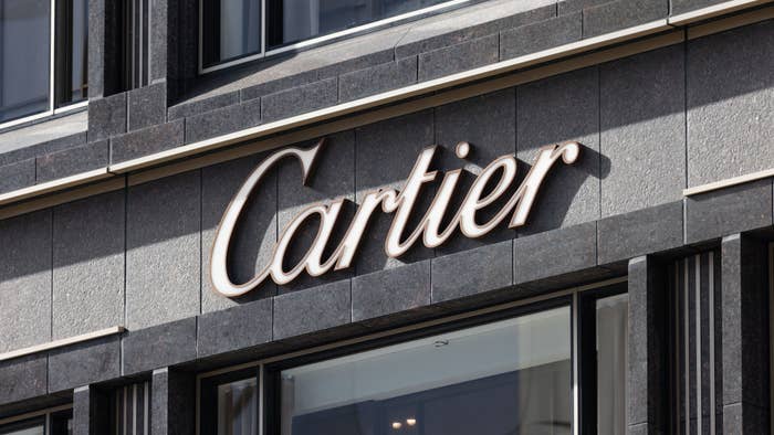 A logo for the Cartier brand is shown