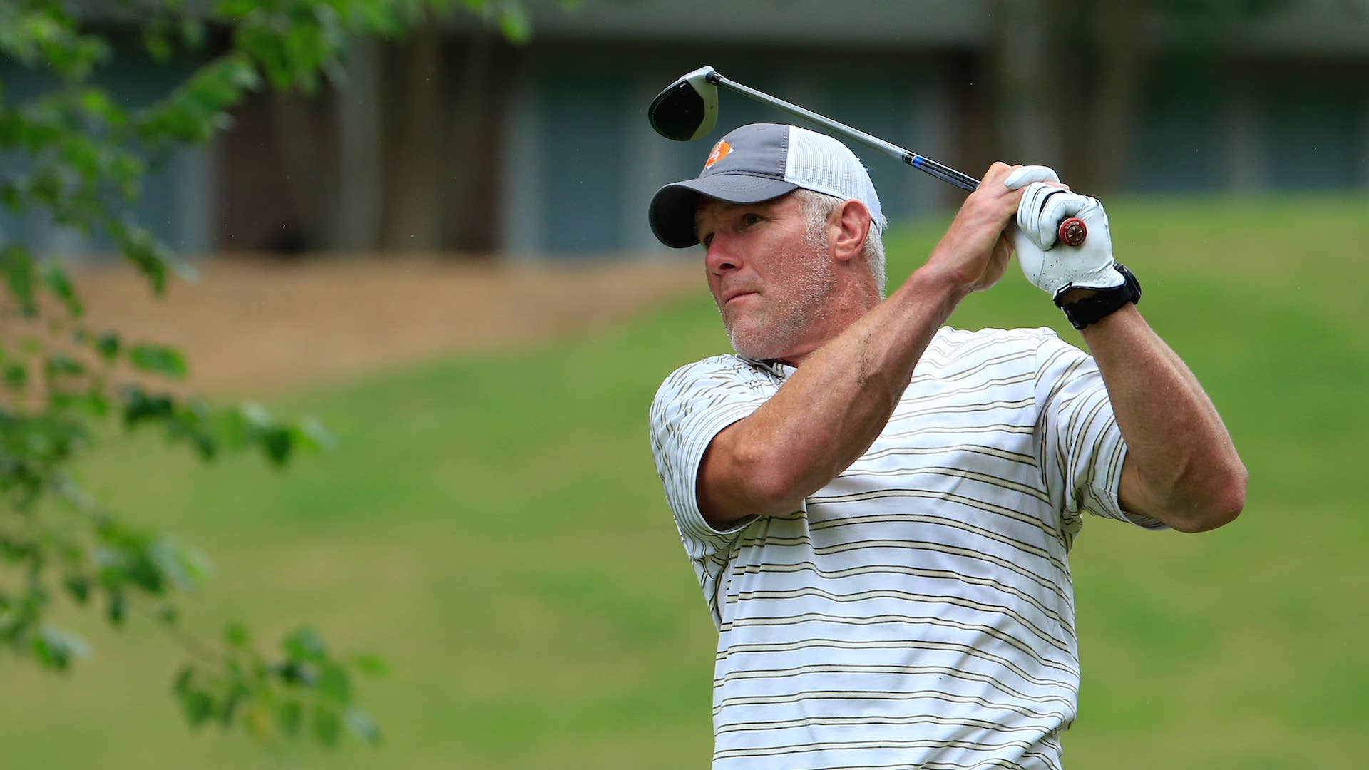 Brett Favre hits his drive on the 12th hole