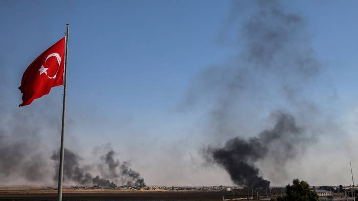 Dark smoke rises at the site of Tell Abyad city of Syria after terrorists burnt tires