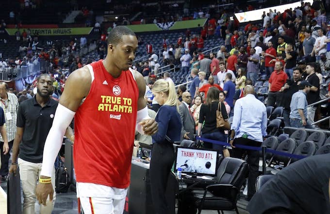Dwight Howard walks off court after Hawks eliminated from playoffs.