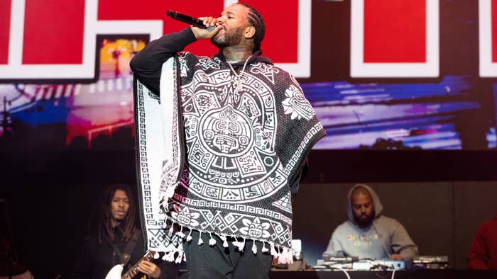 The Game is seen performing at a festival