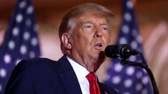 Trump is seen speaking into mic