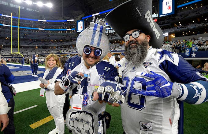 Dallas Cowboys fans on the field before action against the Seattle Seahawks.