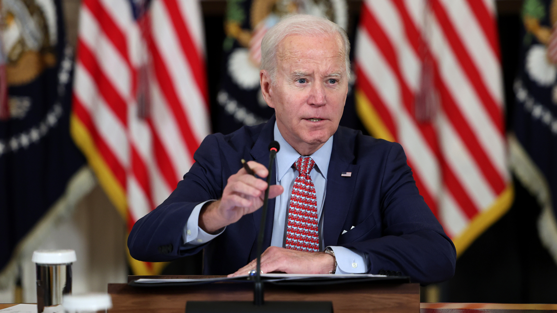 Joe Biden is seen sitting at desk