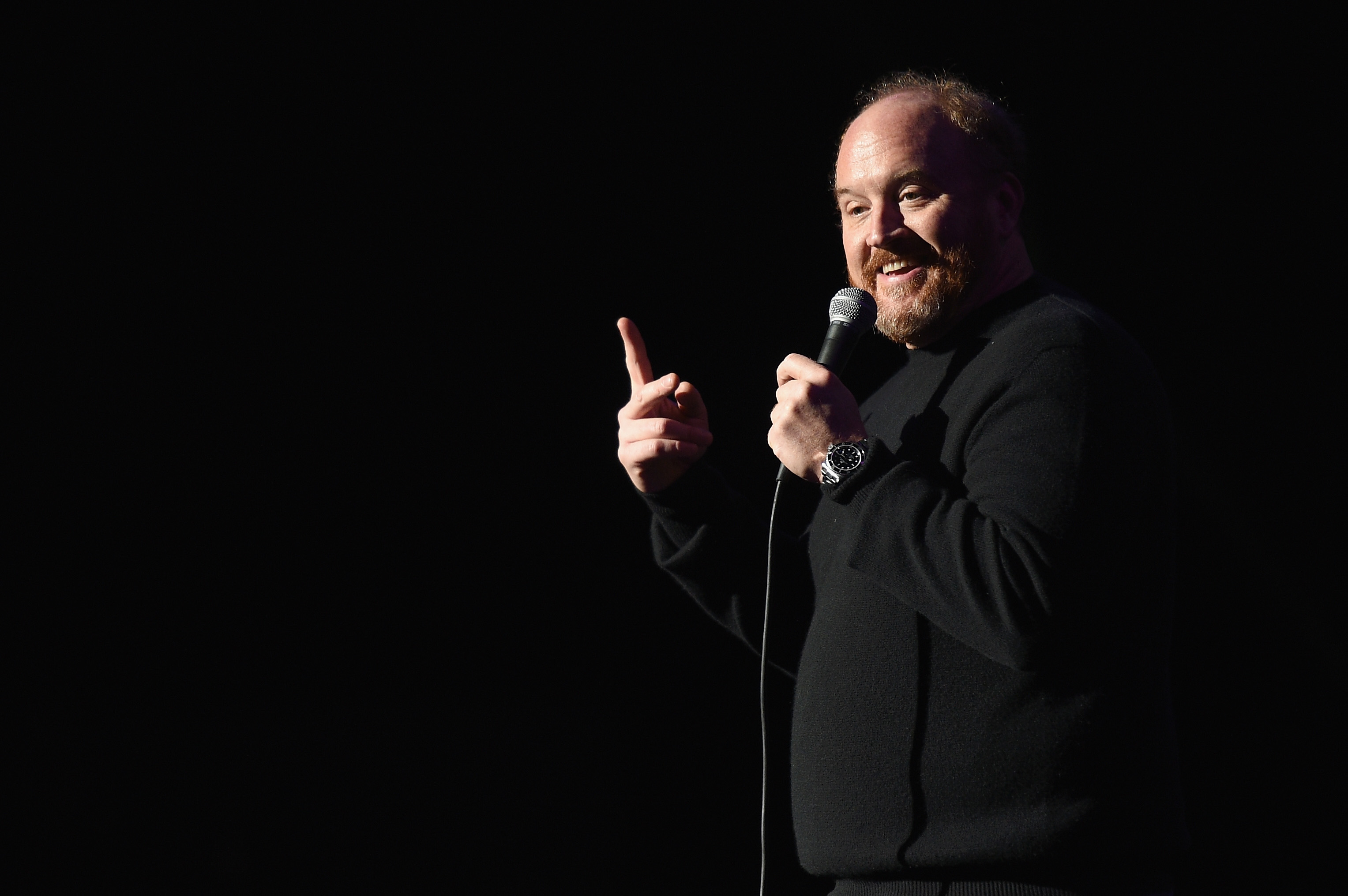 Louis C.K. performs onstage at 2014 Stand Up For Heroes at Madison Square Garden