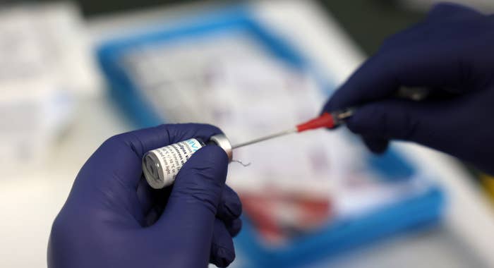 A medical professional prepares a dose of the monkeypox vaccine on July 23, 2022 in London, England