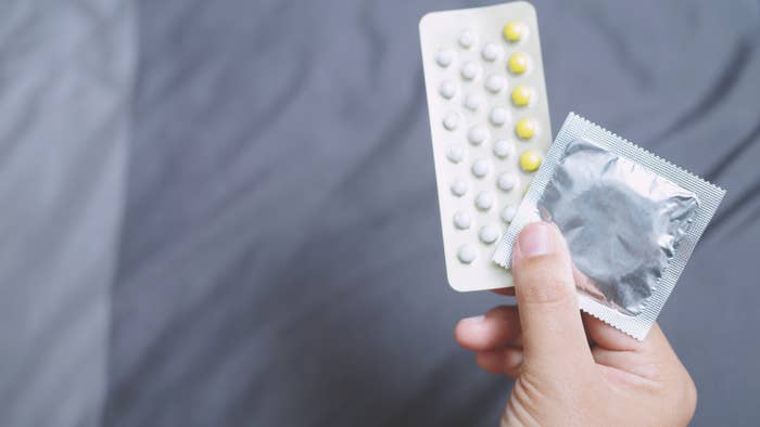 Birth control options pictured on bed